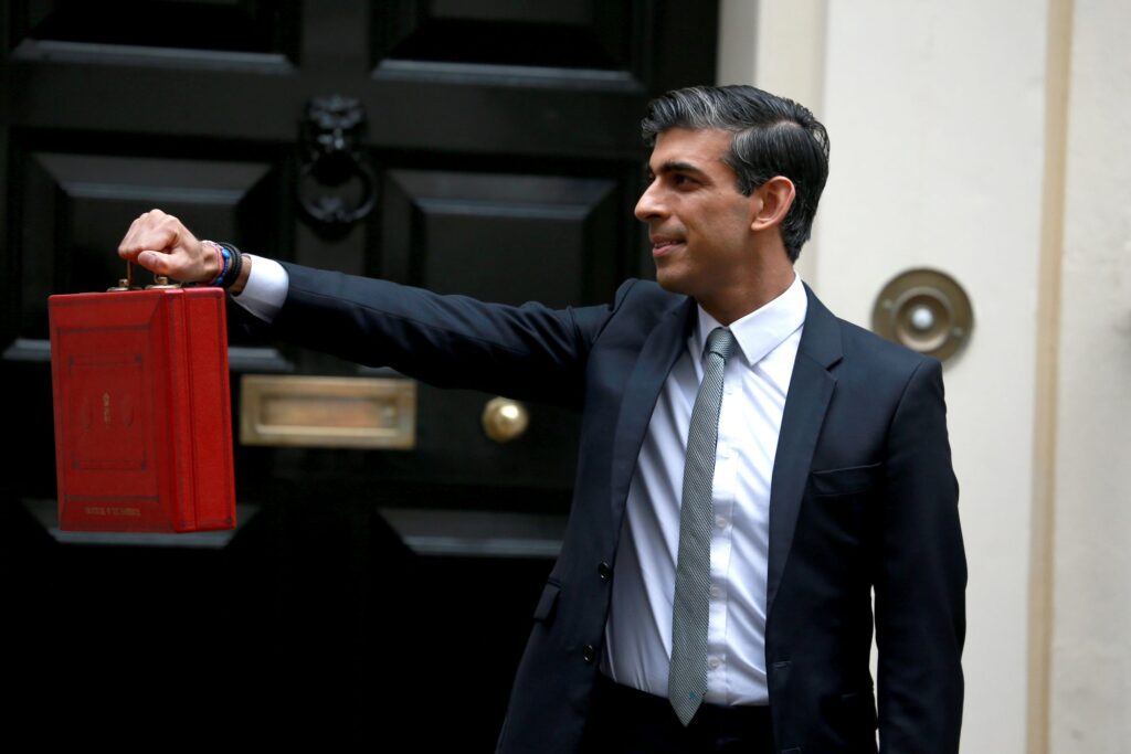 Rishi Sunak (UK's PM) holding box